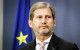 EU Regional Policy Commissioner Johannes Hahn listens during a news conference in Riga